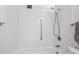 Clean bathroom with shower and white tile at 635 S Alton Way # 1C, Denver, CO 80247