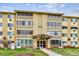 Building at 635 S Alton Way decorated for the holidays with a path and lawn in front at 635 S Alton Way # 1C, Denver, CO 80247