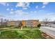 An exterior view of this property featuring lush landscaping and a well-maintained facade at 635 S Alton Way # 1C, Denver, CO 80247