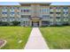 Inviting front entrance with meticulous landscaping leading to the main entrance of the building at 635 S Alton Way # 1C, Denver, CO 80247