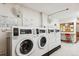 Shared laundry room with multiple washers and dryers at 635 S Alton Way # 1C, Denver, CO 80247