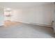 Open living room featuring hardwood and carpet flooring leading into a kitchen at 635 S Alton Way # 1C, Denver, CO 80247