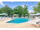 Inviting outdoor pool with lounge chairs and umbrellas at 635 S Alton Way # 1C, Denver, CO 80247