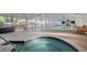 Indoor pool and spa with plenty of seating and natural light at 635 S Alton Way # 1C, Denver, CO 80247