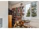 Community reading room with bookshelves and comfy chair at 635 S Alton Way # 1C, Denver, CO 80247