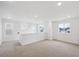 Bonus room with neutral carpet, white walls and large windows offering plenty of natural light at 1362 Rock Cliff Ave, Erie, CO 80516