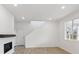 Bright living room featuring a modern fireplace, stairs, and an open floor plan at 1362 Rock Cliff Ave, Erie, CO 80516