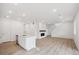 Bright living room featuring an open floor plan and a modern fireplace at 1362 Rock Cliff Ave, Erie, CO 80516