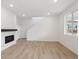 Modern living room featuring an open floor plan and a sleek fireplace at 1362 Rock Cliff Ave, Erie, CO 80516
