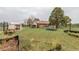 View of the expansive backyard with garden, shed and trees at 1341 Tomichi Dr, Franktown, CO 80116