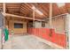 View of stalls in the barn with good light and ventilation at 1341 Tomichi Dr, Franktown, CO 80116