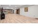 Basement showcasing an open floor plan, kitchenette, and sliding barn doors for added flexibility at 1341 Tomichi Dr, Franktown, CO 80116
