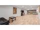 Finished basement boasts luxury vinyl flooring, a cozy sitting area, and a functional kitchenette at 1341 Tomichi Dr, Franktown, CO 80116