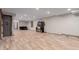 Large open basement with recessed lighting, LVP flooring, ample room for various activities and entertainment at 1341 Tomichi Dr, Franktown, CO 80116