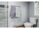 This bathroom features a toilet, towels on a rack, and unique base trim at 1341 Tomichi Dr, Franktown, CO 80116