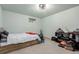 Bedroom features a window for natural light, carpeted floors, and a platform bed at 1341 Tomichi Dr, Franktown, CO 80116