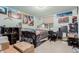Bedroom with posters has a window for natural light, carpeted floors, and closet at 1341 Tomichi Dr, Franktown, CO 80116