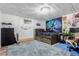 This bedroom features white-washed wood ceiling, blue carpet and a large tree tapestry at 1341 Tomichi Dr, Franktown, CO 80116