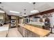 Bright kitchen features stainless steel appliances, large island, and access to an open dining space at 1341 Tomichi Dr, Franktown, CO 80116