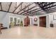 Bright living room featuring exposed beam ceiling, and sunroom views at 1341 Tomichi Dr, Franktown, CO 80116