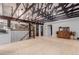 Bright living room features light wood floors, staircase, and exposed beam vaulted ceiling at 1341 Tomichi Dr, Franktown, CO 80116