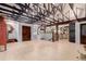 Open living room features light wood floors and exposed beam vaulted ceiling at 1341 Tomichi Dr, Franktown, CO 80116