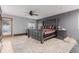 Large main bedroom featuring a ceiling fan, sliding door, and comfortable furnishings at 1341 Tomichi Dr, Franktown, CO 80116