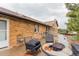 Spacious patio area is ideal for entertaining with outdoor seating at 1341 Tomichi Dr, Franktown, CO 80116