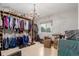 Spacious walk-in closet with custom shelving and ample storage, perfect for organization at 1341 Tomichi Dr, Franktown, CO 80116