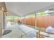 Covered back patio with concrete flooring, outdoor seating, and a wooden fence at 926 S Fillmore Way, Denver, CO 80209