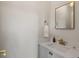 Bathroom featuring a white sink, gold faucet, and a modern countertop at 926 S Fillmore Way, Denver, CO 80209