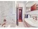 Elegant bathroom with a marble vanity, patterned floors, and modern fixtures at 926 S Fillmore Way, Denver, CO 80209