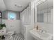 Charming bathroom with black and white tile floors and vintage-style fixtures at 926 S Fillmore Way, Denver, CO 80209