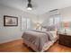 Cozy bedroom with hardwood floors, neutral decor, and ample natural light at 926 S Fillmore Way, Denver, CO 80209