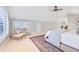 Bright bedroom with neutral colors, carpet, ceiling fan, and large windows at 926 S Fillmore Way, Denver, CO 80209