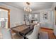 Elegant dining room with chandelier and seating for six, perfect for entertaining at 926 S Fillmore Way, Denver, CO 80209