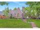 Charming brick home featuring a manicured lawn, brick steps, mature trees, and stylish curb appeal at 926 S Fillmore Way, Denver, CO 80209