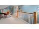 Hallway landing with white-painted railing and a cozy home office space in view at 926 S Fillmore Way, Denver, CO 80209