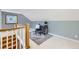 Bright home office space with a blue accent wall, desk, and staircase at 926 S Fillmore Way, Denver, CO 80209