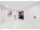 Spacious laundry room with modern washer and dryer, marble floors and white walls at 926 S Fillmore Way, Denver, CO 80209