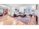 Bright living room with hardwood floors, neutral decor, large windows and stylish furnishings at 926 S Fillmore Way, Denver, CO 80209