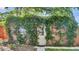 Charming brick outbuilding covered in lush green foliage at 926 S Fillmore Way, Denver, CO 80209