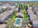 The aerial view showcases community amenities like a pool and green spaces, enhancing the living experience at 3061 W 92Nd Ave # 8B, Westminster, CO 80031