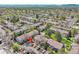 This aerial view highlights the neighborhood layout, revealing homes and parking at 3061 W 92Nd Ave # 8B, Westminster, CO 80031