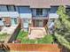 Aerial view of the backyard reveals a private wooden deck and lush green space, perfect for outdoor enjoyment at 3061 W 92Nd Ave # 8B, Westminster, CO 80031