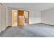 Bedroom featuring neutral walls, carpeting, and access to additional rooms at 3061 W 92Nd Ave # 8B, Westminster, CO 80031
