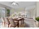 Inviting dining area with modern table set, sliding glass doors, and seamless kitchen access at 3061 W 92Nd Ave # 8B, Westminster, CO 80031