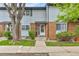 Charming townhome featuring brick and siding, complemented by mature trees and a well-manicured lawn at 3061 W 92Nd Ave # 8B, Westminster, CO 80031