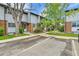 View of the townhome exterior with parking, showcasing neat landscaping and well-maintained building facades at 3061 W 92Nd Ave # 8B, Westminster, CO 80031