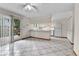 Open-concept kitchen with breakfast bar, stainless steel appliances, and sliding glass door to backyard at 3061 W 92Nd Ave # 8B, Westminster, CO 80031